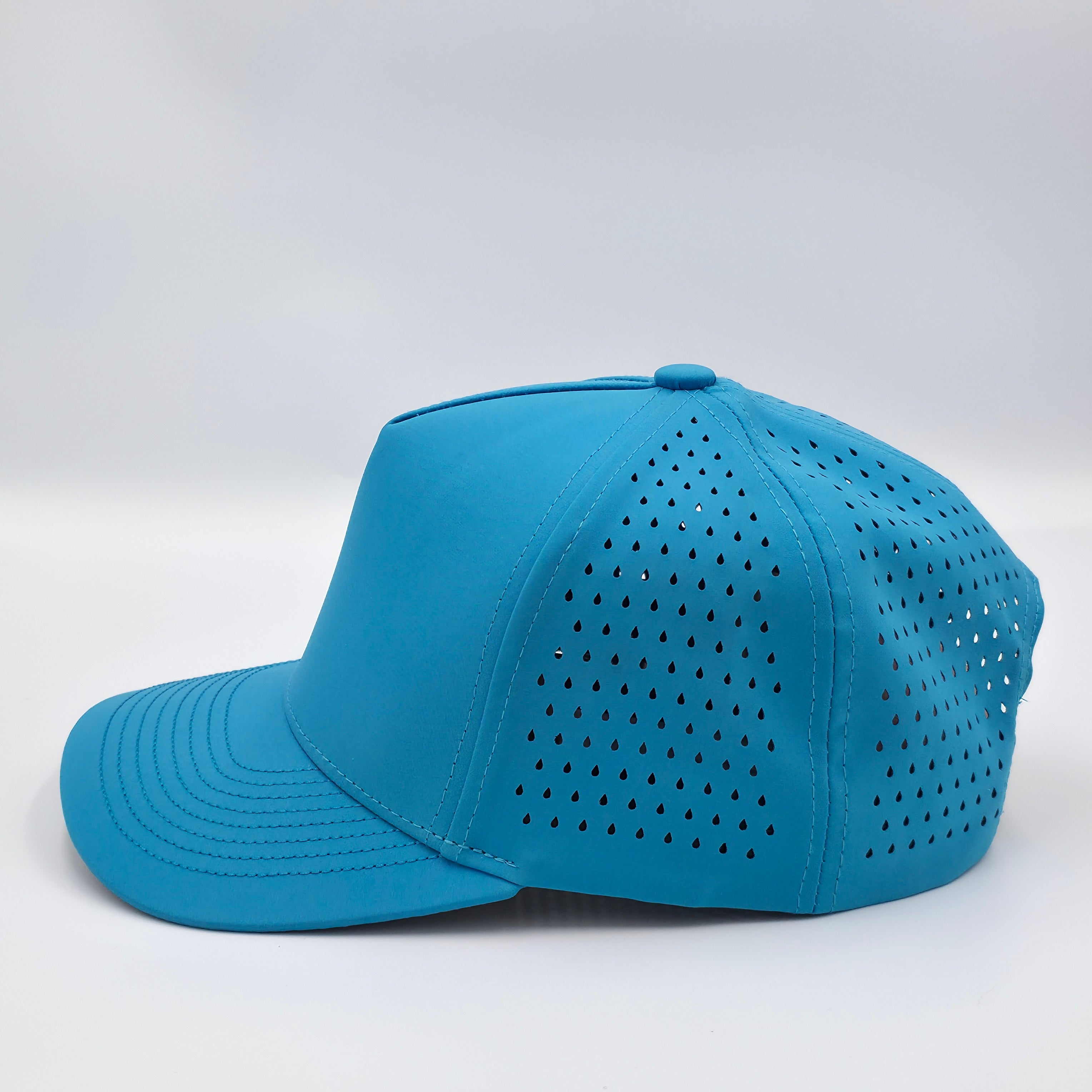 Blue cap with perforated design on a white background variant-classic-57cm-to-59cm-havablue