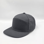 Gray cap with perforated design on a light gray background variant-carbon-charcoal
