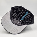 Underside of cap with 'MERAKI' branding on a light gray background variant-carbon-charcoal