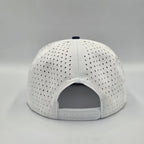 Multicolored cap with navy, white, and red sections on a light gray background variant-seventy-six