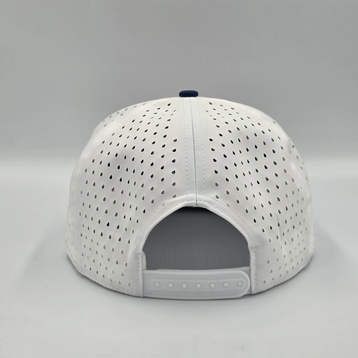 Multicolored cap with navy, white, and red sections on a light gray background variant-seventy-six
