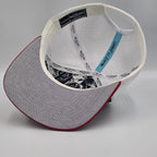 Multicolored cap with navy, white, and red sections on a light gray background variant-seventy-six