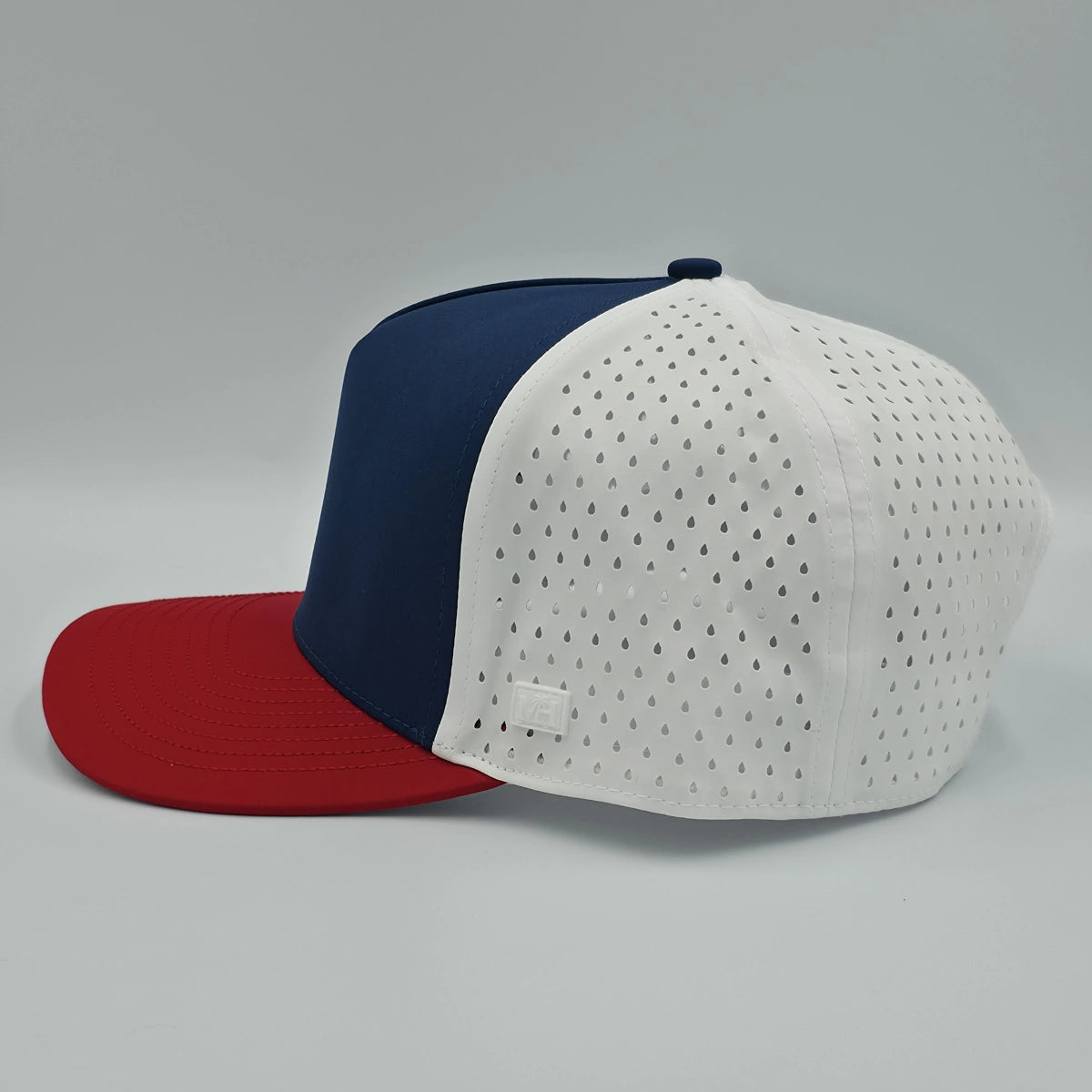 Navy blue and red cap with white mesh back on a gray background variant-classic-57cm-to-59cm-seventy-six